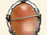 a picture of a picture of a pendant with an orange stone