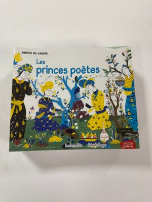 un livre sur lequel figure la photo d'une femme en robe jaune et d'un homme en costume noir
