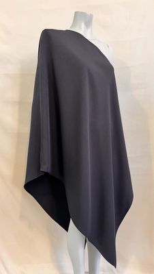 a woman ' s black poncher on a mannequin head