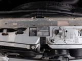 a close up of a car ' s engine with its hood open