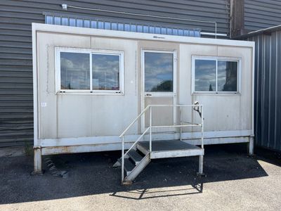 an image of a portable home with stairs and a ramp