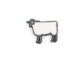un mouton noir et blanc debout sur une surface blanche