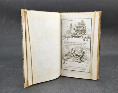 an open book with a picture of a man on a horse in a field