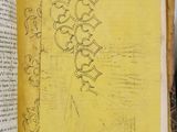 an open book with a drawing on it sitting on a table