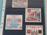 four different stamps on a piece of paper on the wall