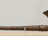 an old bronze pipe with a bird on it