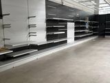 a large empty store with shelves in the middle of the room