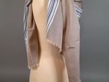 a close up of a mannequin head with a scarf on it