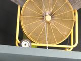 a fan that is sitting on top of a shelf