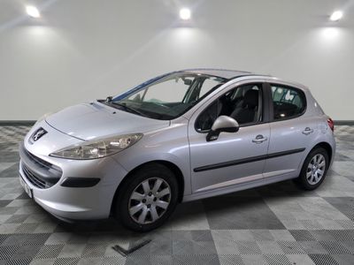 a picture of a silver car parked in a garage