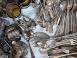 a wooden box filled with silverware and utensils