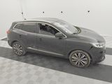 a picture of a gray car parked in a garage