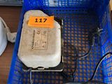 a blue basket with a computer and wires in it
