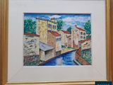 framed watercolor painting of a canal in a small town