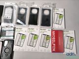 many different cases of cell phones on the table