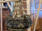 a large metal object hanging from the ceiling in a room