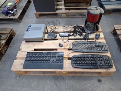 wooden pallet with computer equipment on top of it in a warehouse