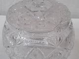 a glass jar with a lid sitting on a table