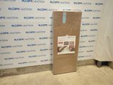 a cardboard box sitting on the floor in front of a wall