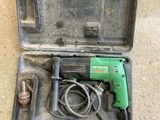 a person standing next to a tool in a case