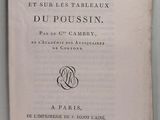 un vieux livre posé sur une table à côté d'un mur