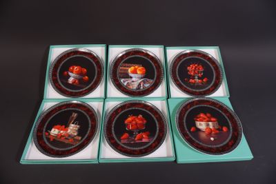 six plates with a picture of a man and a woman on them