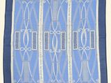 a blue and white handkerchief with a design on it