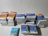 several boxes of allergies sitting on a table next to each other