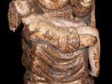 an image of a statue of a woman sitting on a chair