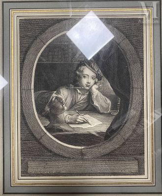 framed picture of a young man writing a letter at a desk