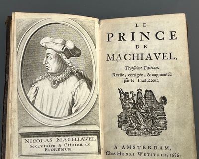 an old book with a picture of a man in a hat on top of it