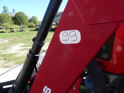 a close up of a red tractor with a sticker on it