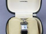 an image of a watch in a case on a table