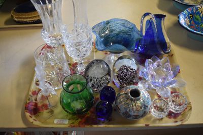 a tray that has many different glass items on it