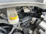 a close up of a car ' s engine with the hood open