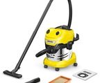 Un aspirateur jaune est posé à côté d'un kit de nettoyage