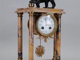 a statue of a lion on top of a clock