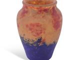 a vase that is sitting on a white surface