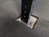 a close up of a metal pole with holes in it