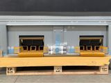 a large metal container with two windows on a pallet