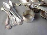 a lot of silver spoons and spoon spoons on a table