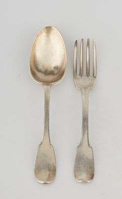 two silver spoons and a fork on a white surface