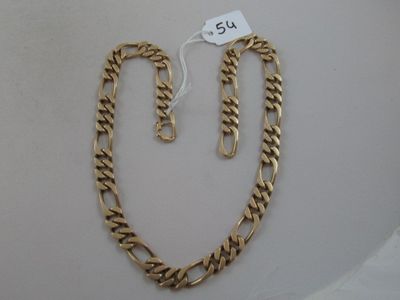 a close up of a gold chain with a tag on it
