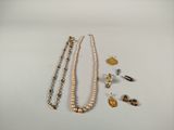 a lot of jewelry that is laying out on the table