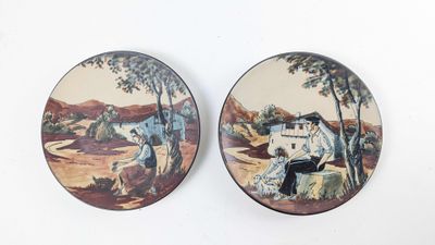 two plates with a picture of a man and a dog on them