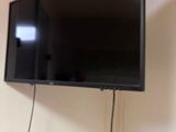 a flat screen tv hanging on the wall in the room