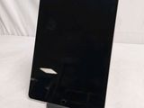 an image of a black tablet computer sitting on top of a table