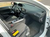 the interior of a car with the door open showing the steering wheel and dashboard