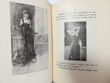 an open book with a picture of a woman in a long dress