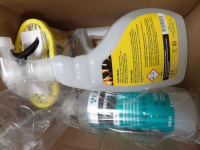 a bottle of liquid and a bottle of liquid in a box